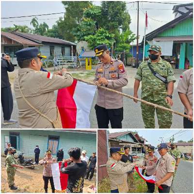 Wakapolres Gunung Mas Bagikan Bendera Merah Putih ke Warga